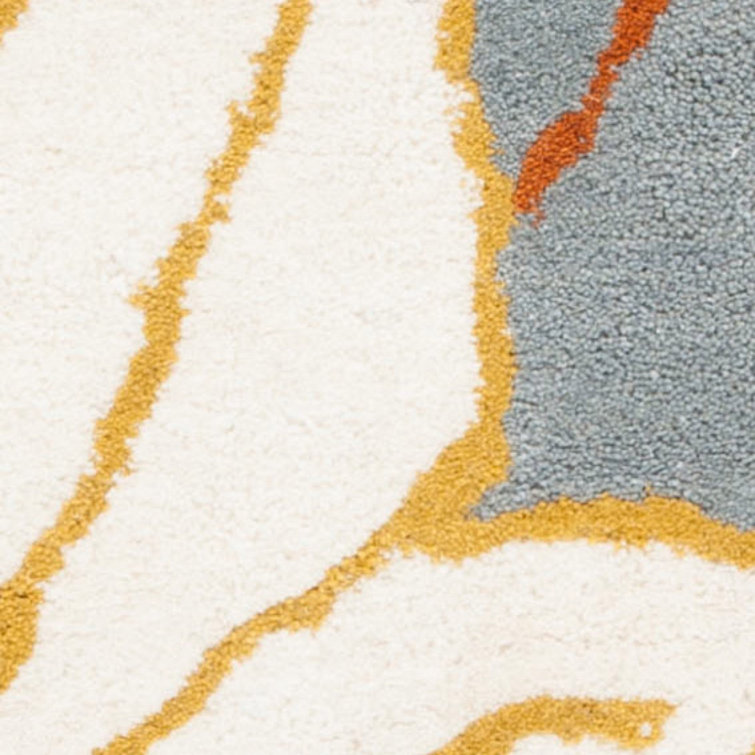 Handmade Blue and Multi Wool Tufted Area Rug