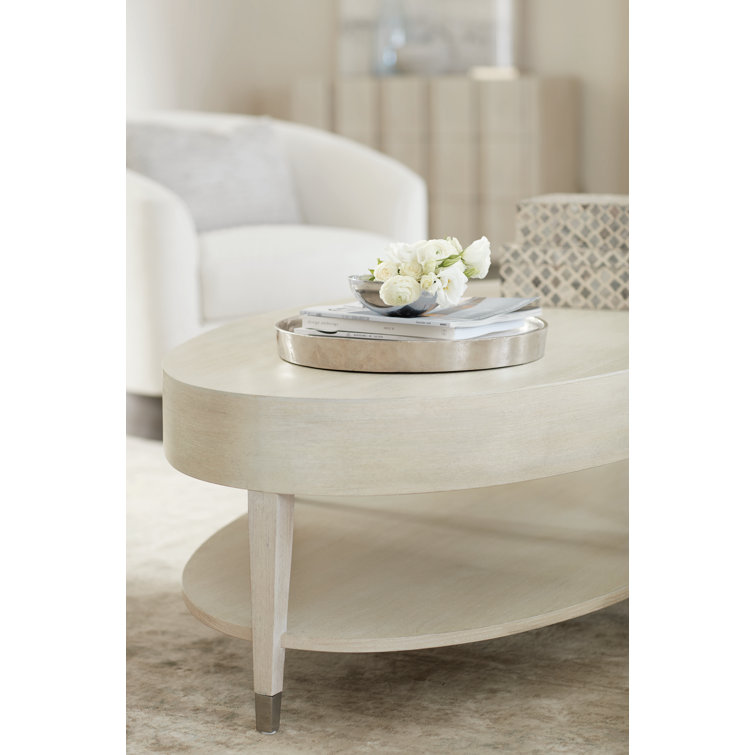 Transitional Cream Oval Coffee Table with Metal Accents and Storage