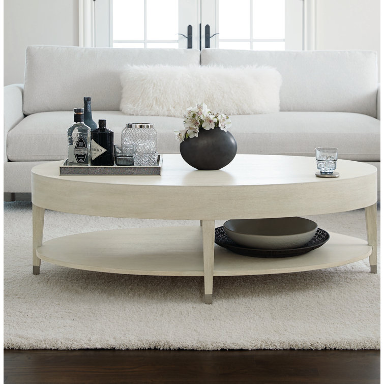 Transitional Cream Oval Coffee Table with Metal Accents and Storage