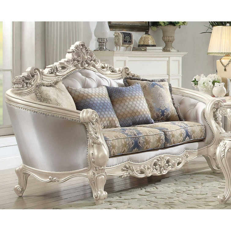 Elegant Floral Tufted Fabric Loveseat with Rolled Arms and Nailhead Accents