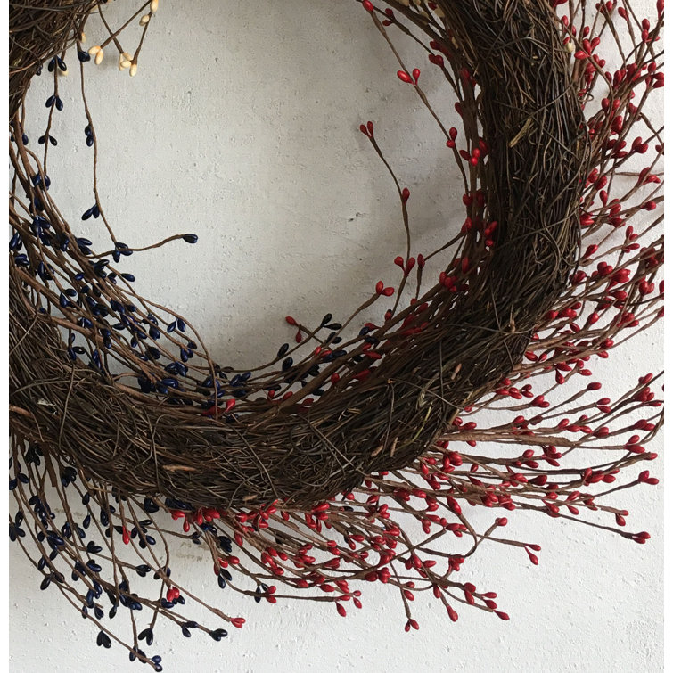 22'' Handcrafted Faux Grapevine Wreath with Blue, Red, and White Berries