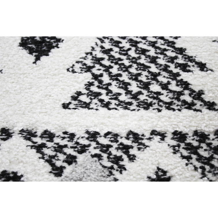 Handmade Geometric Black Synthetic 8' x 10' Stain-Resistant Rug