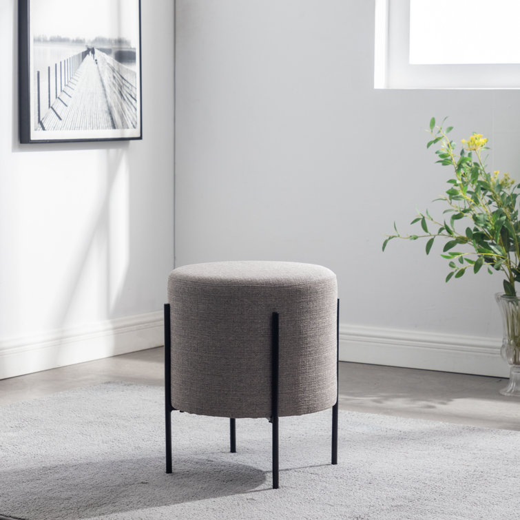 Gray Round Upholstered Ottoman with Black Metal Base
