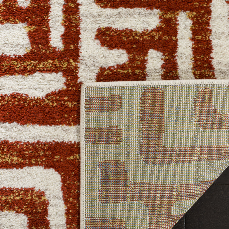 Ivory and Terracotta Geometric Synthetic 4' x 6' Area Rug