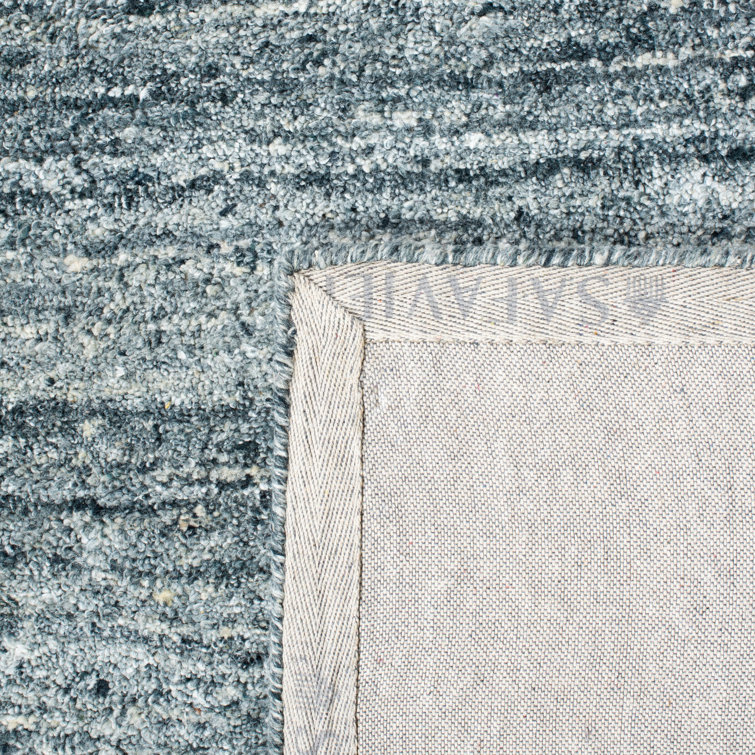 Handmade Himalaya Tufted Blue Wool Rectangular Rug - 5' x 8'