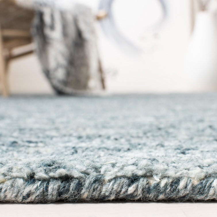 Handmade Himalaya Tufted Blue Wool Rectangular Rug - 5' x 8'