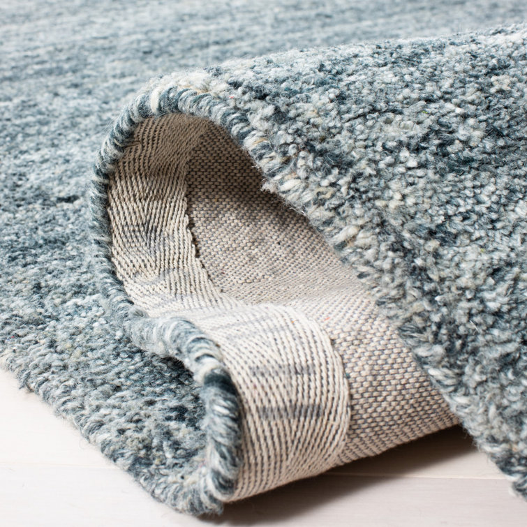 Handmade Himalaya Tufted Blue Wool Rectangular Rug - 5' x 8'