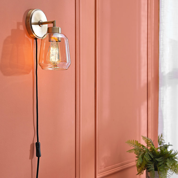 Salma Matte Brass Dimmable Wall Sconce with Smoked Amber Glass