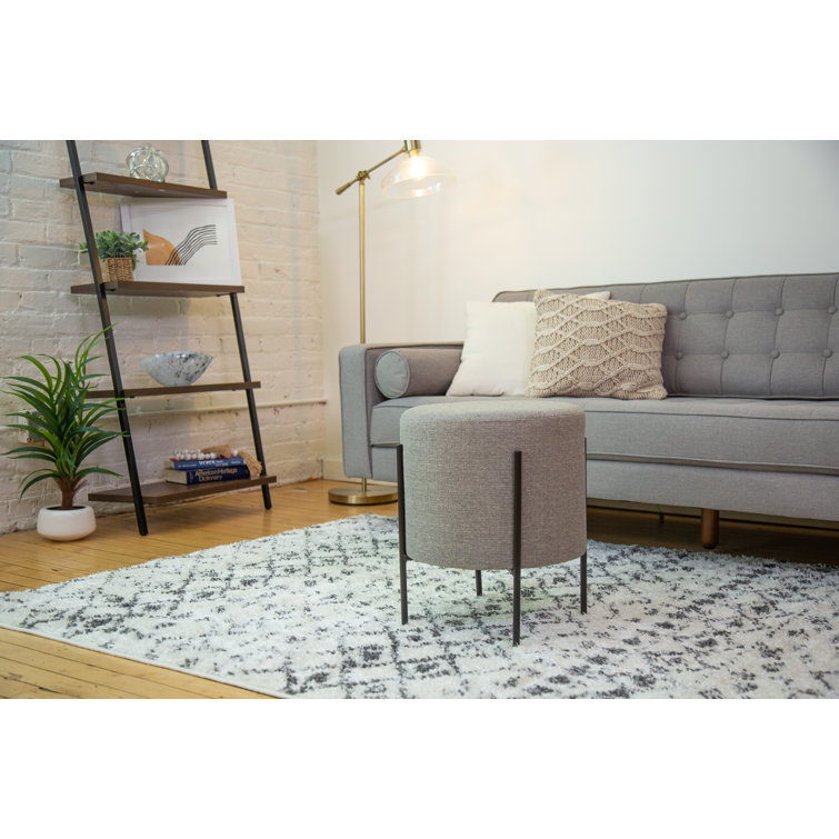 Gray Round Upholstered Ottoman with Black Metal Base
