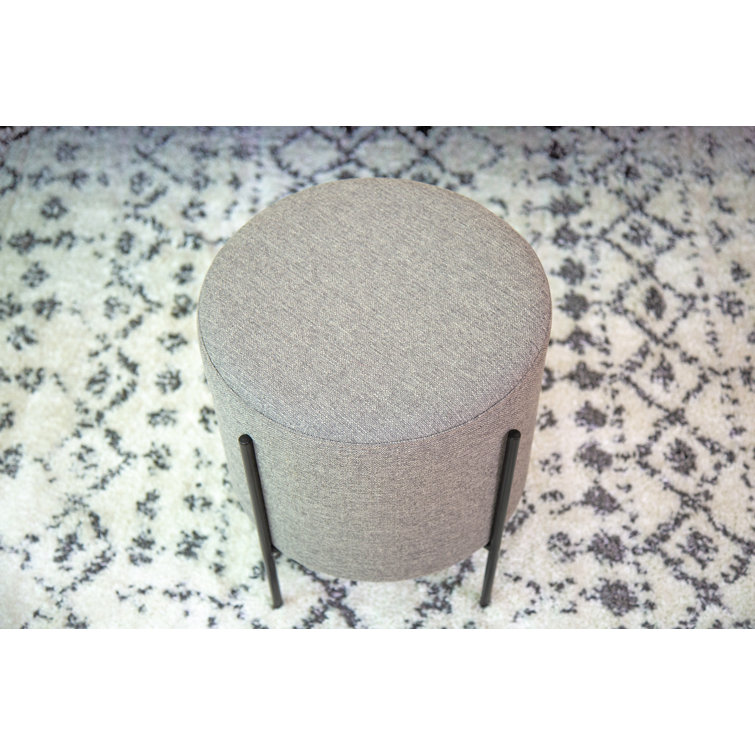 Gray Round Upholstered Ottoman with Black Metal Base