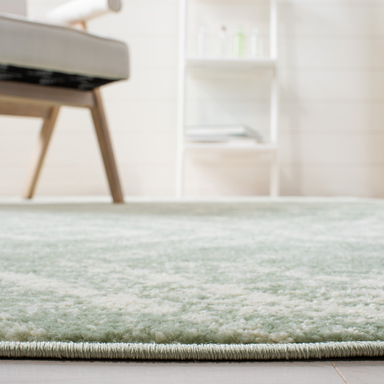 Green and Ivory Geometric Synthetic 4' x 6' Rectangular Rug