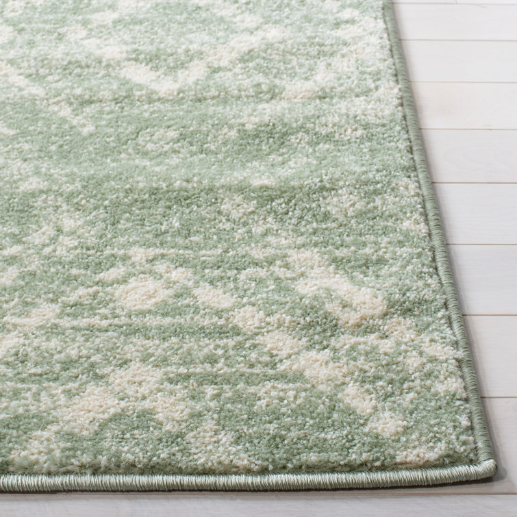 Green and Ivory Geometric Synthetic 4' x 6' Rectangular Rug