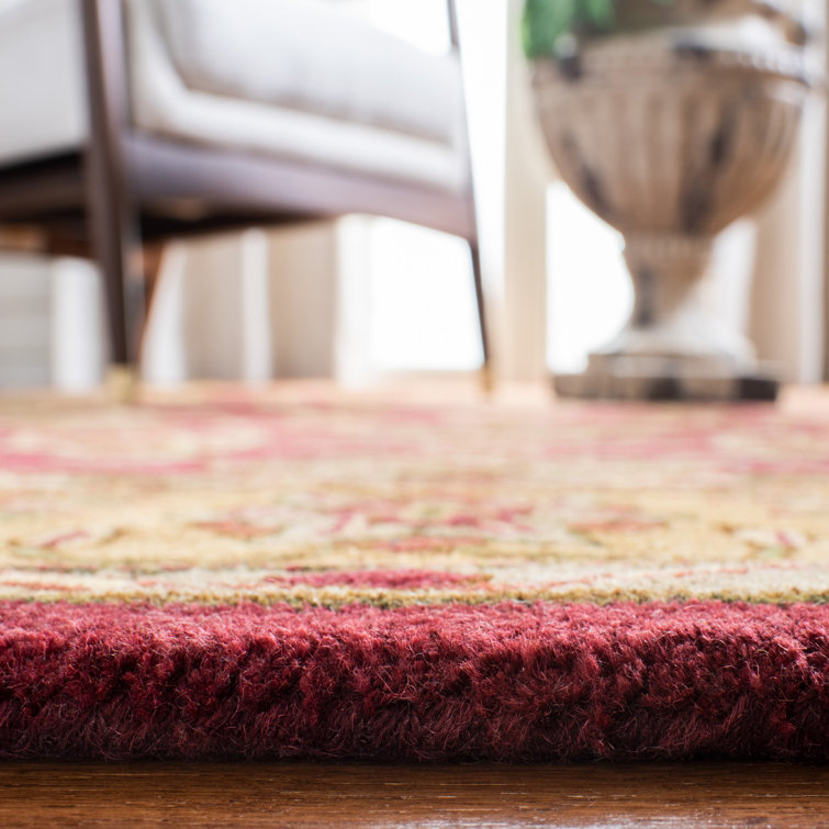 Handmade Round Burgundy and Gold Wool Area Rug