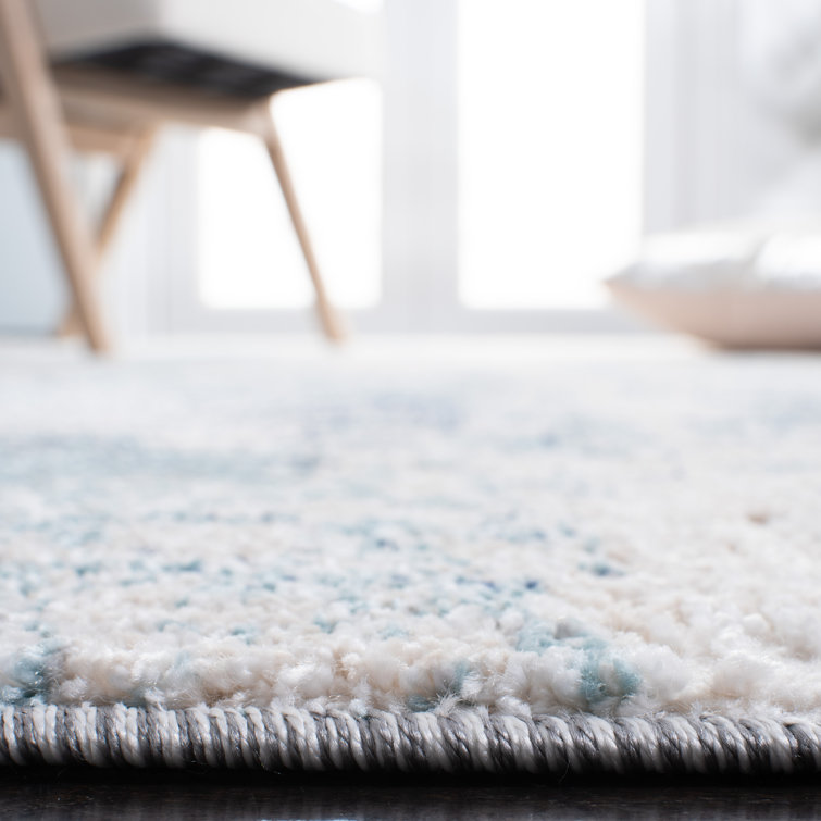 Ivory and Blue Abstract Synthetic Area Rug, 3' x 5'