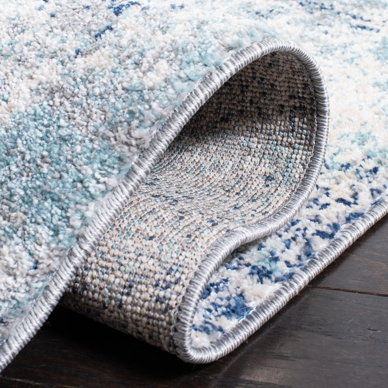 Ivory and Blue Abstract Synthetic Area Rug, 3' x 5'