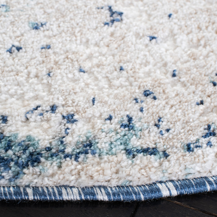 Ivory and Blue Abstract Synthetic Area Rug, 3' x 5'