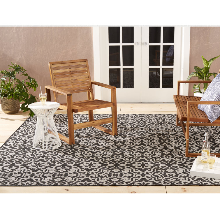 Danica 5'2" x 7'2" Black/Gray Synthetic Medallion Area Rug