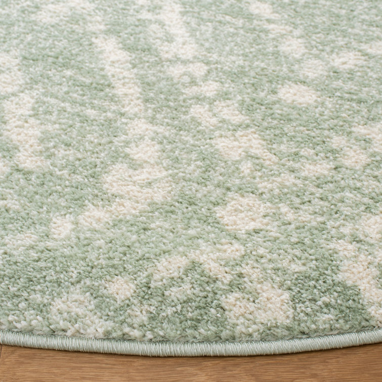 Green and Ivory Geometric Synthetic 4' x 6' Rectangular Rug