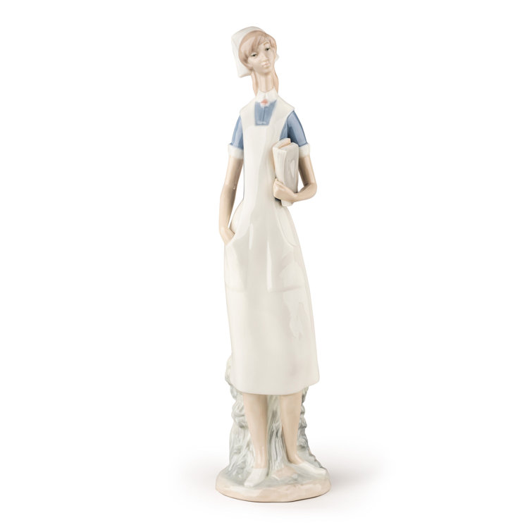 Matte White Porcelain Nurse Figurine with Delicate Petal Details
