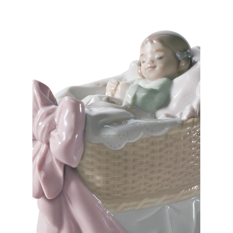 Glossy Porcelain Newborn Girl Bassinet Figurine with Pink Bow