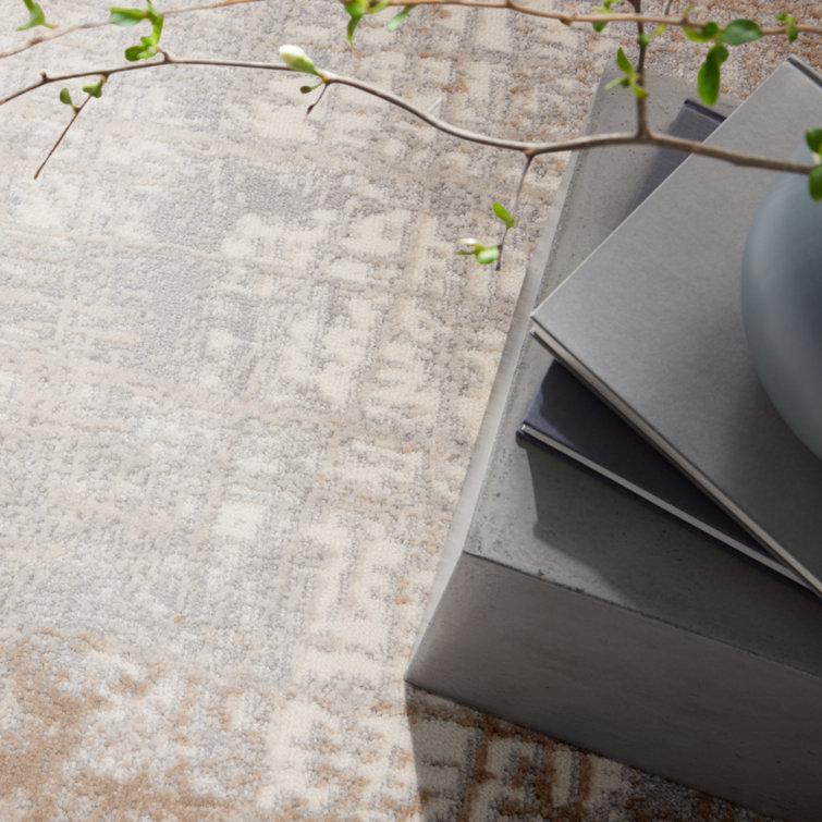 Ivory and Taupe Round Abstract Synthetic Rug, 4 ft