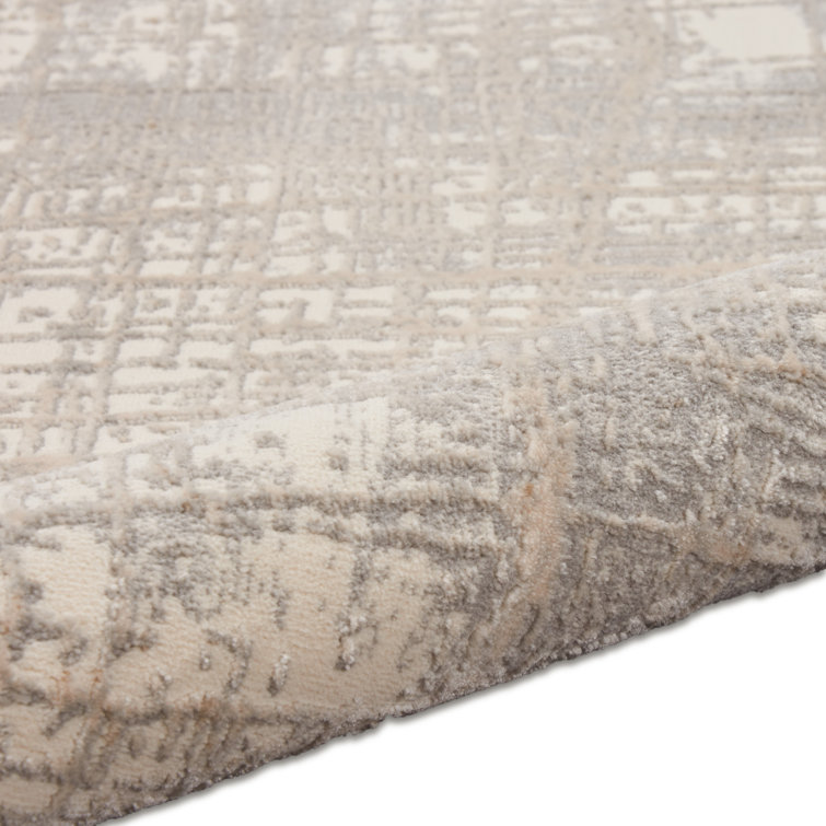 Ivory and Taupe Round Abstract Synthetic Rug, 4 ft