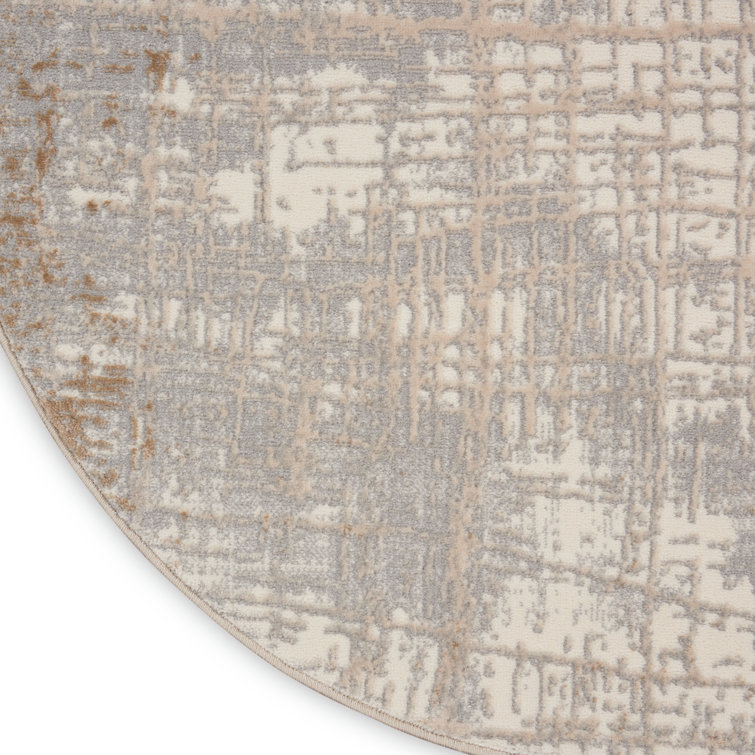 Ivory and Taupe Round Abstract Synthetic Rug, 4 ft