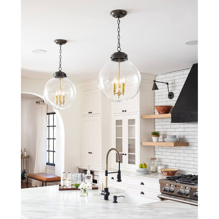 Clear Glass Globe Pendant with Oil Rubbed Bronze and Brass Finish