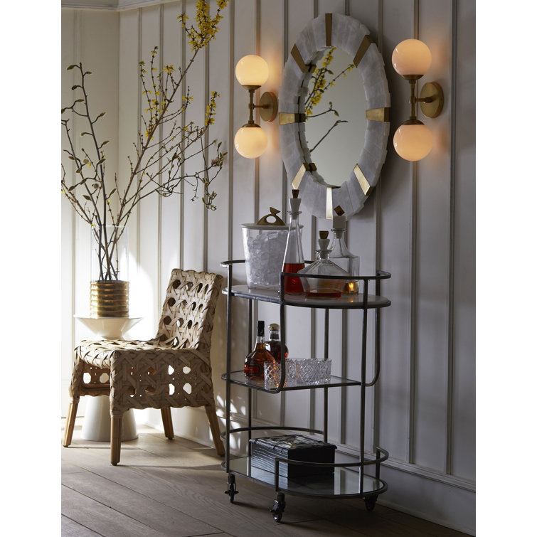 Polaris Dual-Orb Glass and Antique Brass Wall Sconce