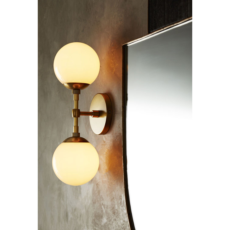 Polaris Dual-Orb Glass and Antique Brass Wall Sconce