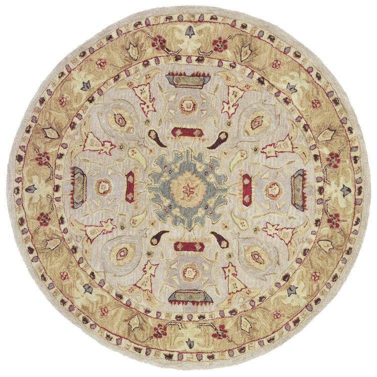 Handmade Ivory and Gold Round Wool Area Rug