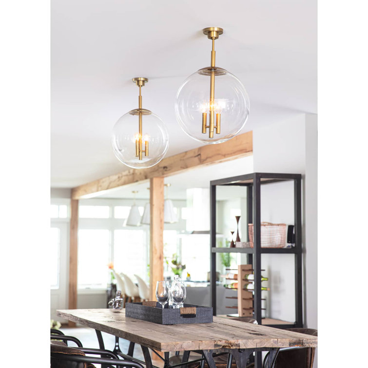 Elegance in Illumination: 3-Light Natural Brass Globe Pendant