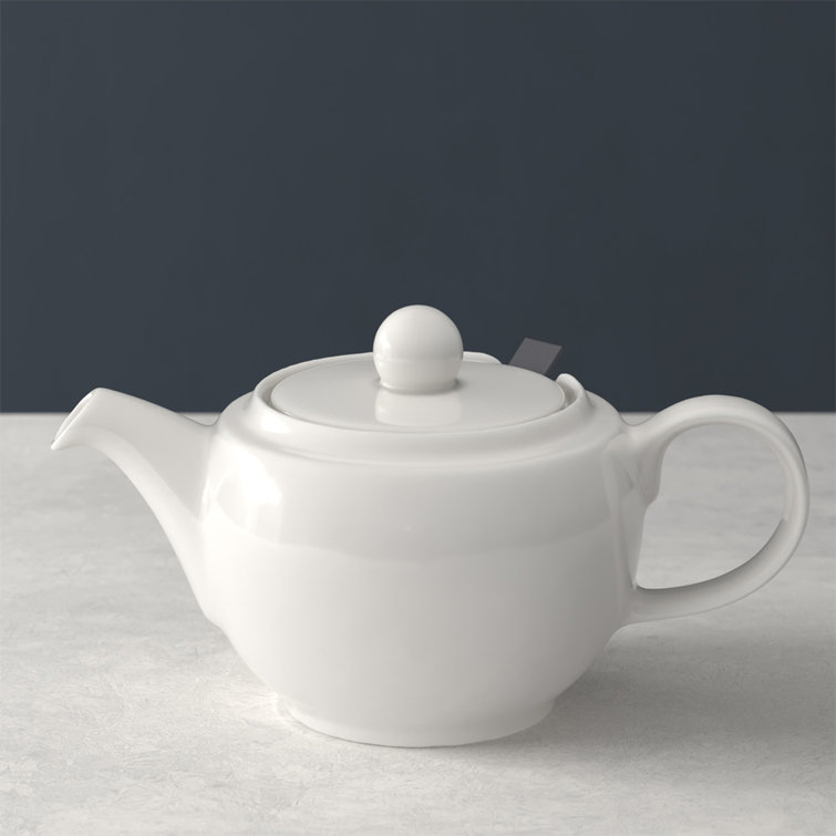 Elegant White Porcelain Teapot with Lid and Strainer