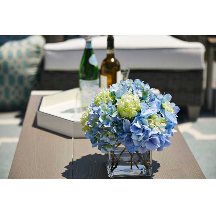 Blue Hydrangeas and Roses in Glass Vase Arrangement