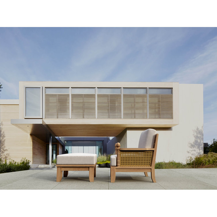 Teak Lounge Chair with Orange Cushions and Wicker Sides