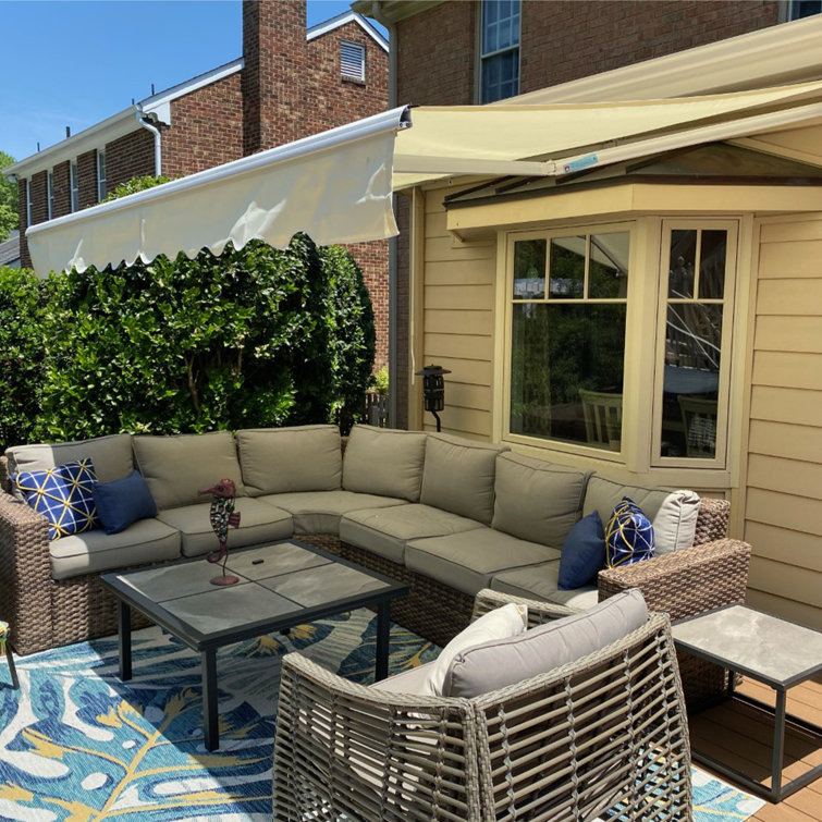Ivory Motorized Retractable Patio Awning with White Frame