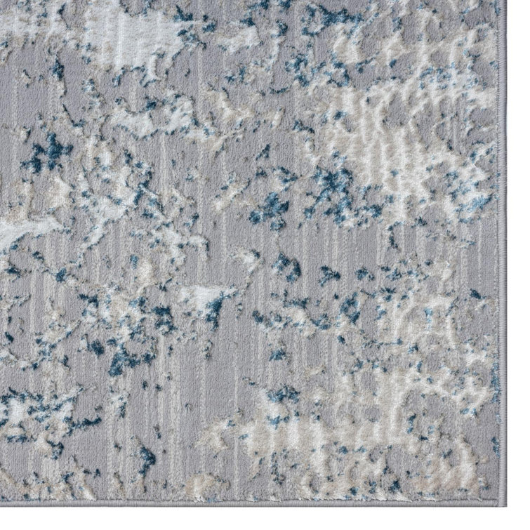 Blue and Ivory Abstract 9' x 12' Synthetic Area Rug