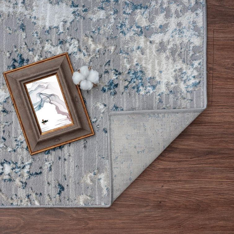 Blue and Ivory Abstract 9' x 12' Synthetic Area Rug