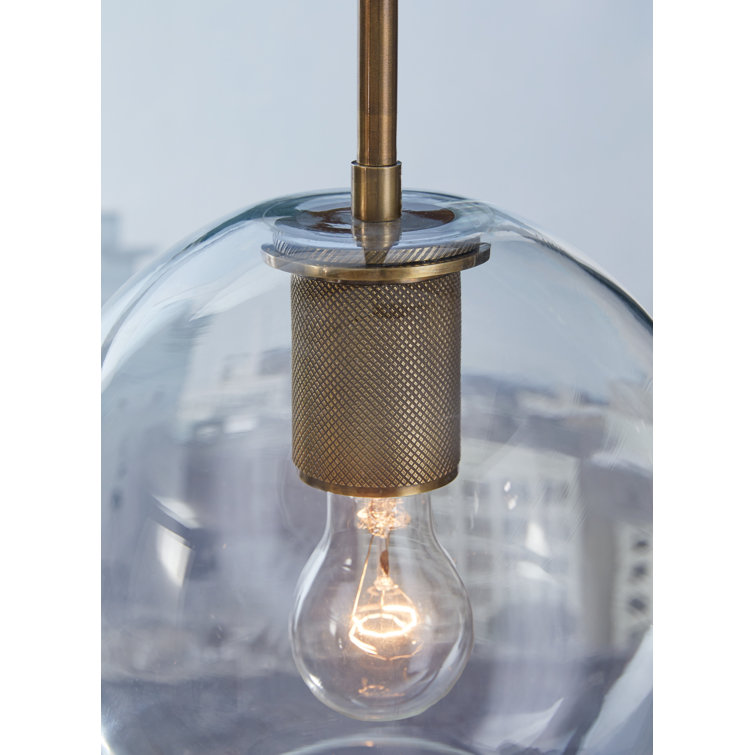 Cordunn 9" Clear Glass Globe Pendant with Antiqued Brass Finish