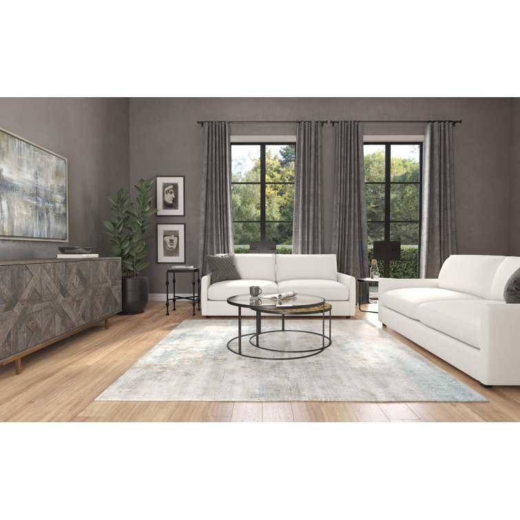Beige and Black Round Wood and Metal Nesting Coffee Table Set