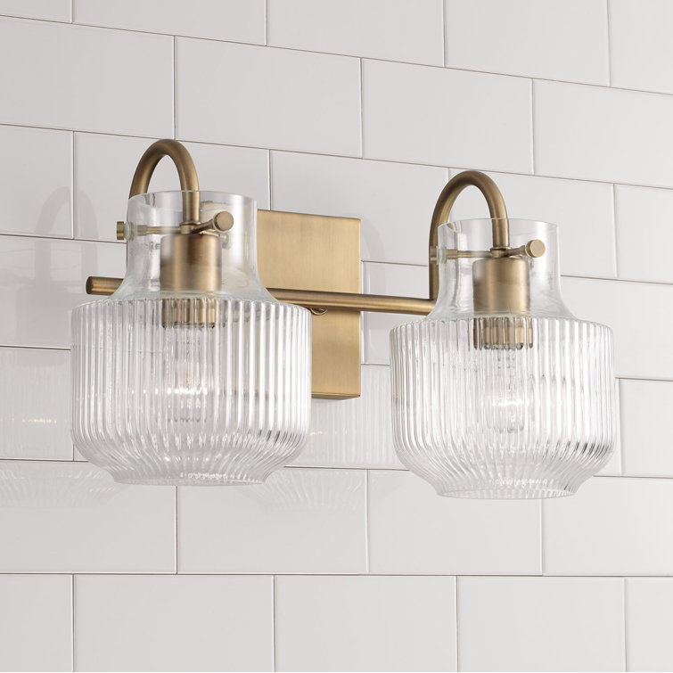 Aged Brass 2-Light Vanity with Clear Fluted Glass