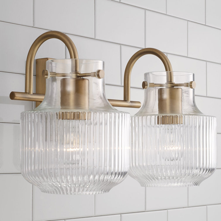 Aged Brass 2-Light Vanity with Clear Fluted Glass
