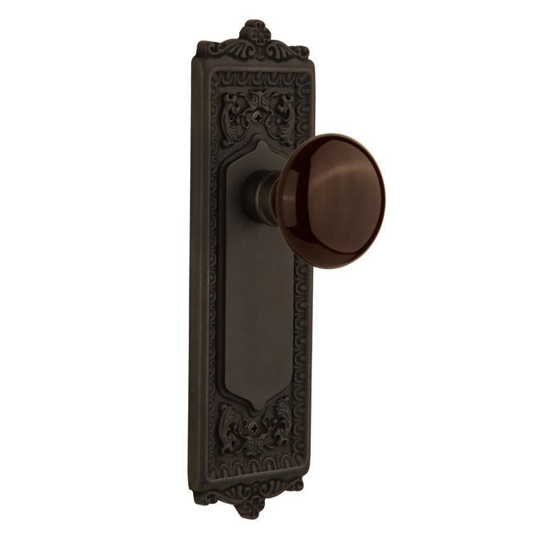 Oil-Rubbed Bronze Egg & Dart Plate with Brown Porcelain Door Knob