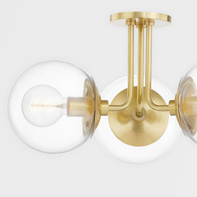 Meadow Transitional 3-Light Semi-Flush Mount in Aged Brass with Clear Globe Shades