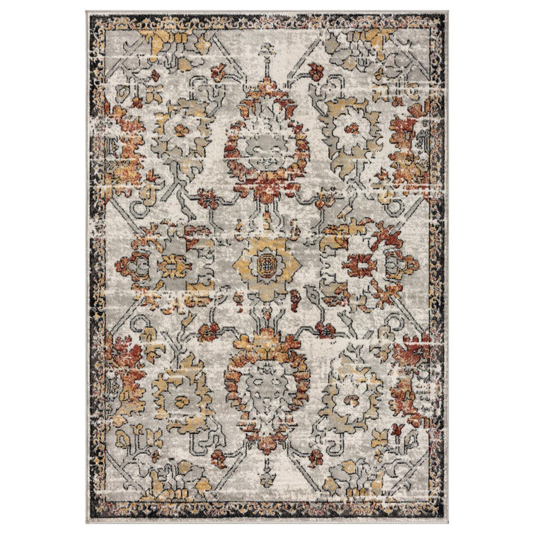 Distressed Orange and Beige Floral 6' x 9' Synthetic Area Rug