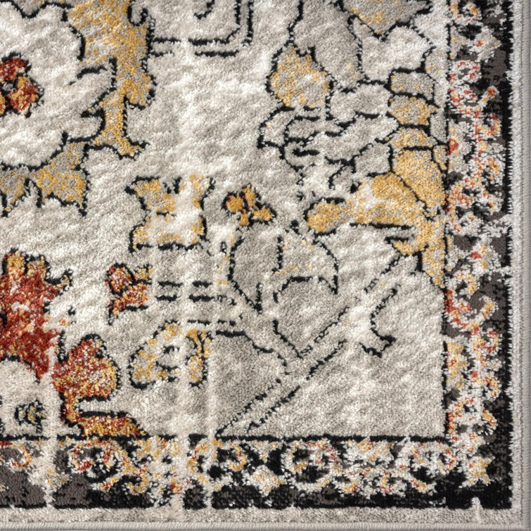 Distressed Orange and Beige Floral 6' x 9' Synthetic Area Rug