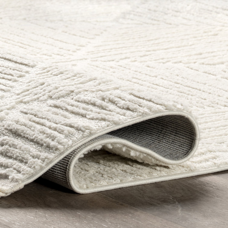 Cream Geometric Tasseled 4' x 6' Synthetic Area Rug