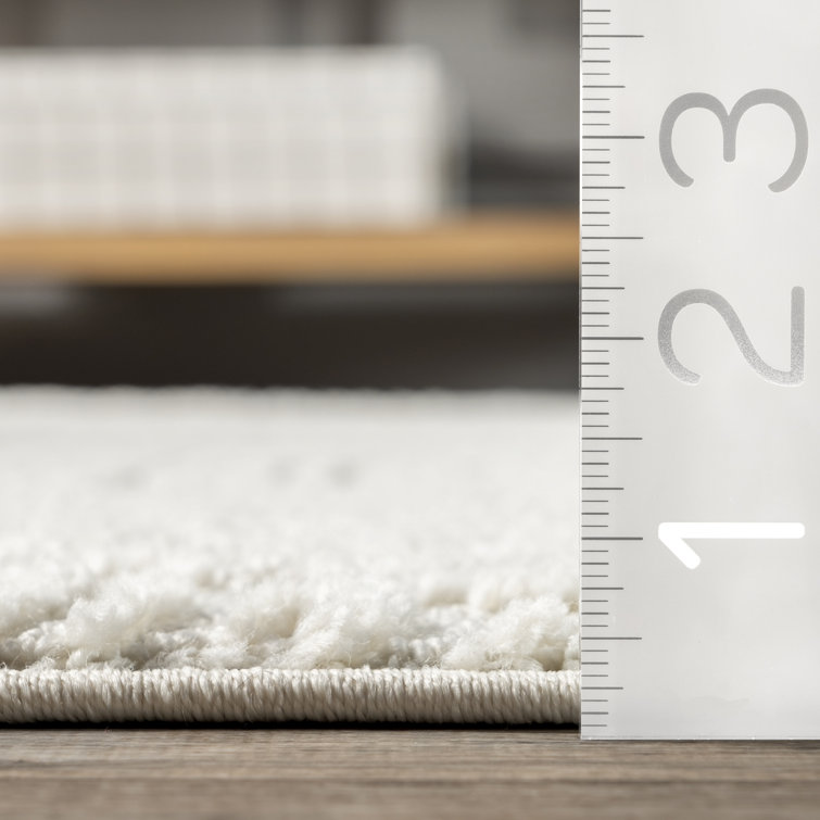 Cream Geometric Tasseled 4' x 6' Synthetic Area Rug