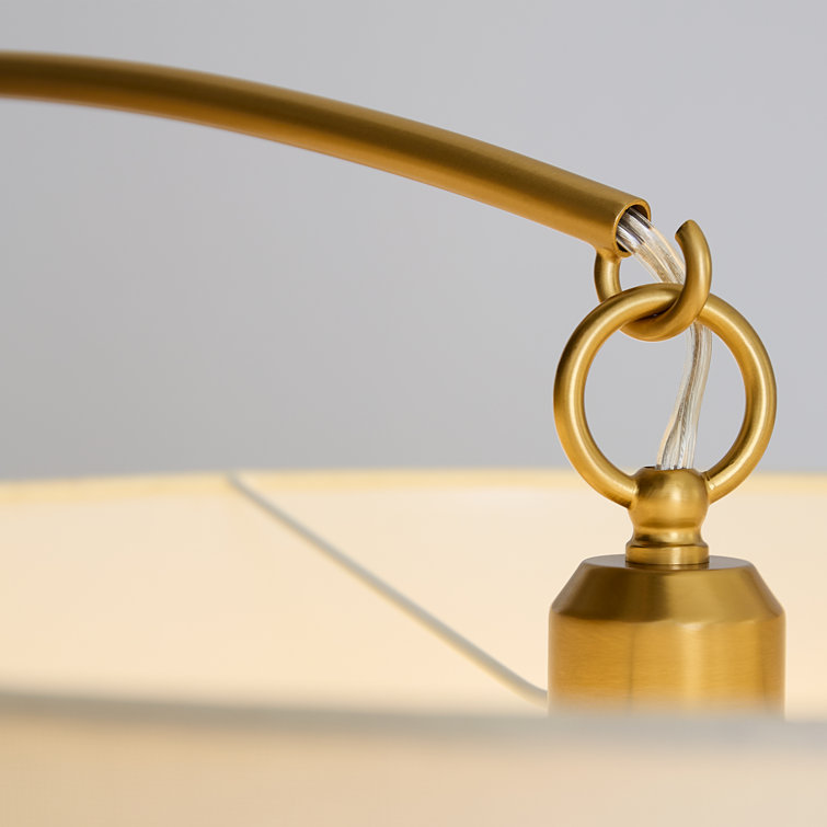 Sawyer Adjustable Double Tiered Arc Floor Lamp in Burnished Brass
