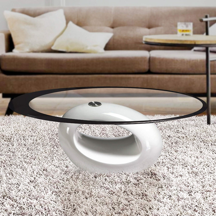 White Oval Glass Top Coffee Table with Abstract Base